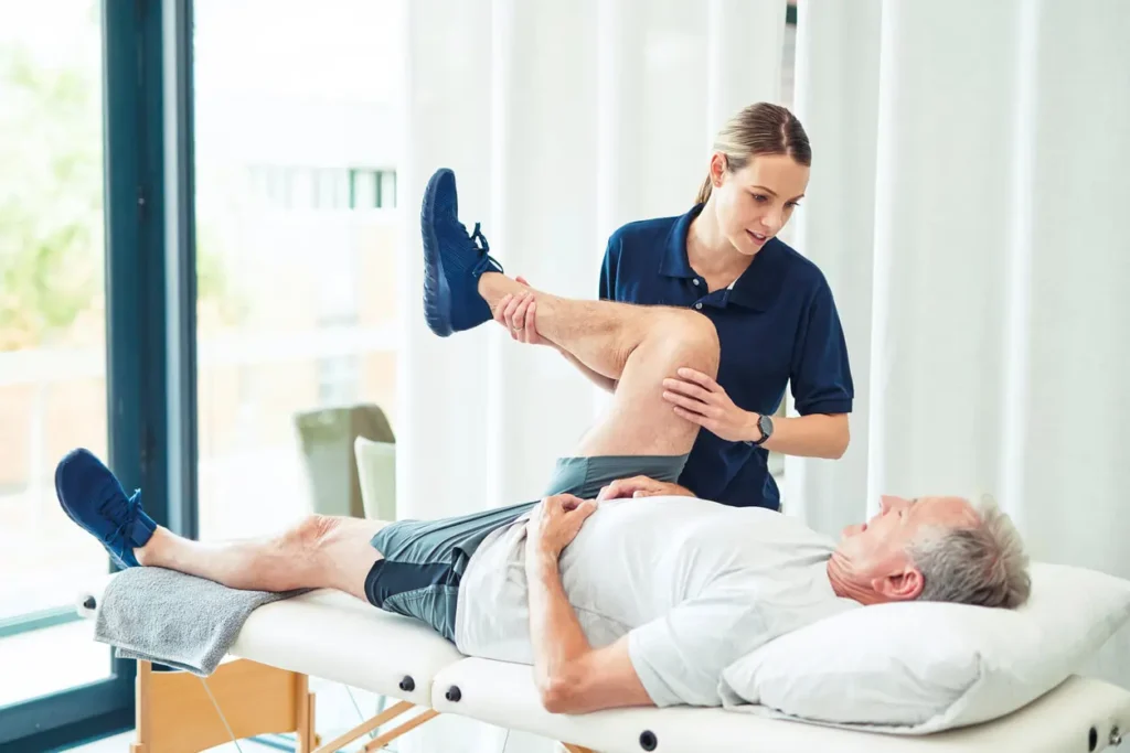 Revitalising Recovery: Effective Rehabilitation Strategies for Muscle Injuries 3 Physiotherapist assisting a patient with muscle recovery exercises Hertford