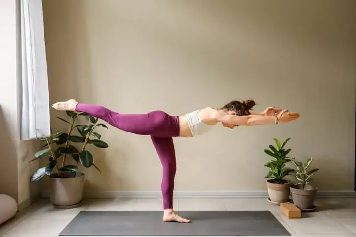 Woman doing Yoga exercise Hertford to help with toning the body. 