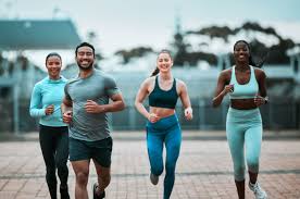 Sculpting Sleek Arms: The Essential Role of Cardio in Toning Without Bulking Up 3 image of people running to incorporate cardio Hertford exercise into their life to help tone arms and body.